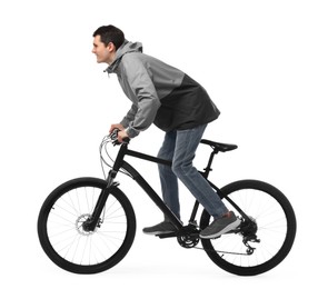 Photo of Young man riding bicycle on white background