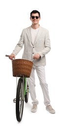 Smiling man in sunglasses with bicycle and basket isolated on white