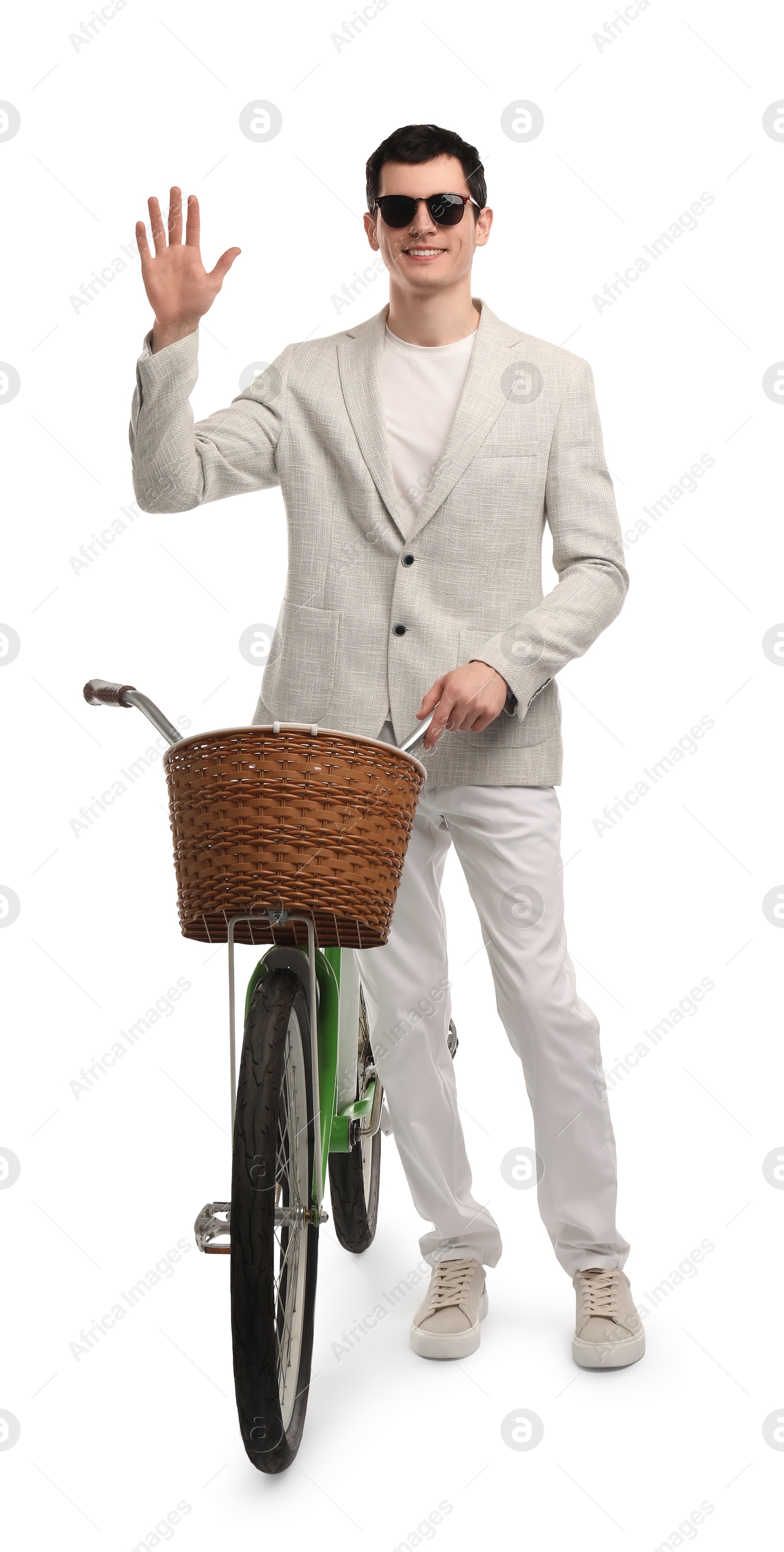 Photo of Smiling man in sunglasses with bicycle and basket isolated on white