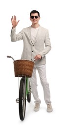 Photo of Smiling man in sunglasses with bicycle and basket isolated on white