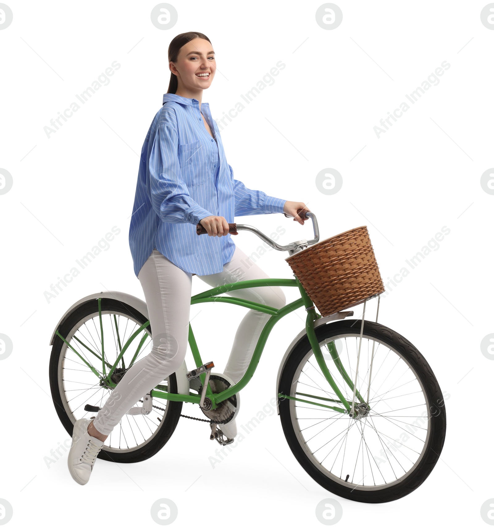 Photo of Smiling woman on bicycle with basket against white background