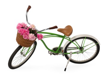 Photo of Bicycle with basket of pink peony flowers isolated on white