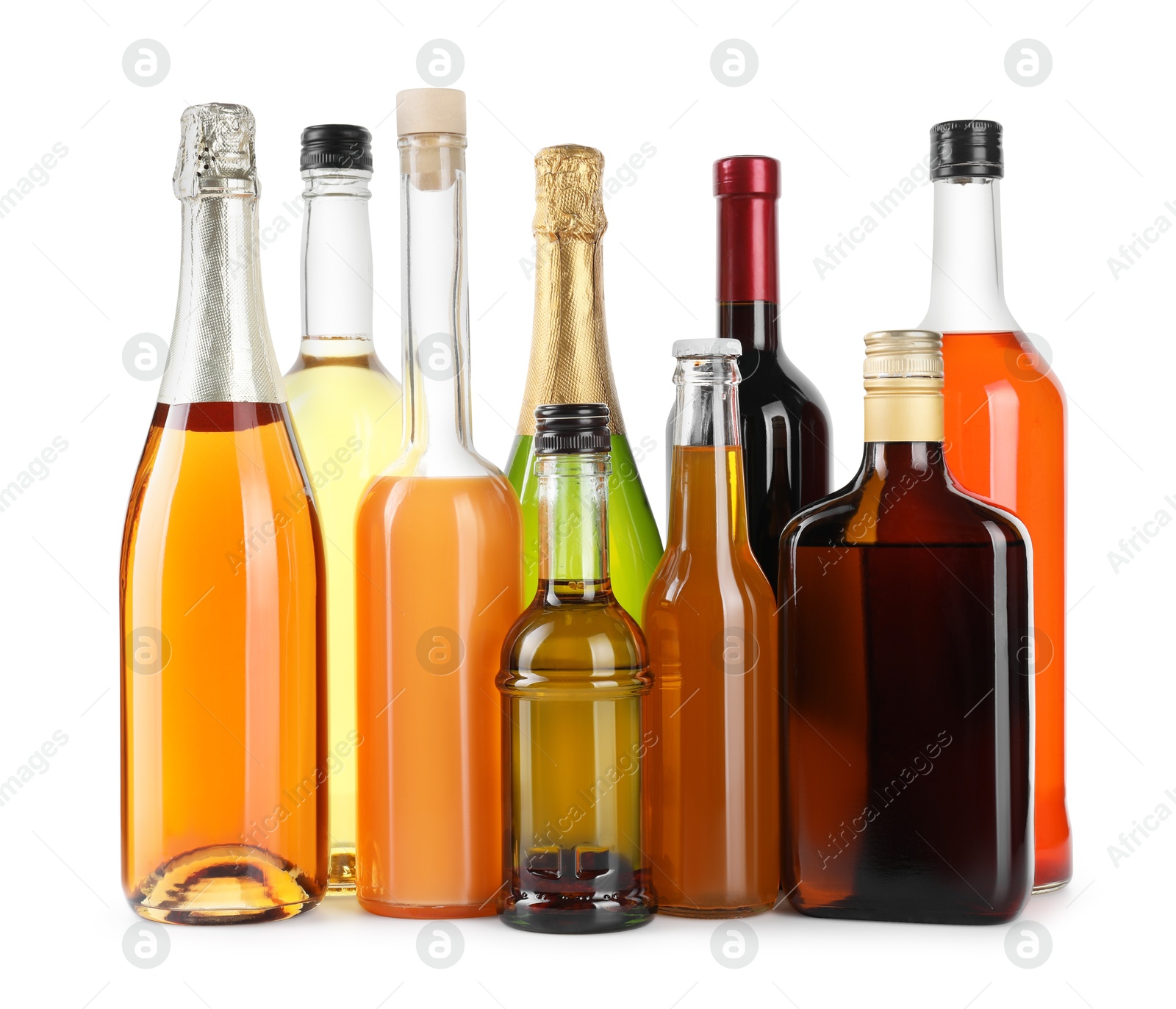 Photo of Bottles of different alcoholic drinks isolated on white