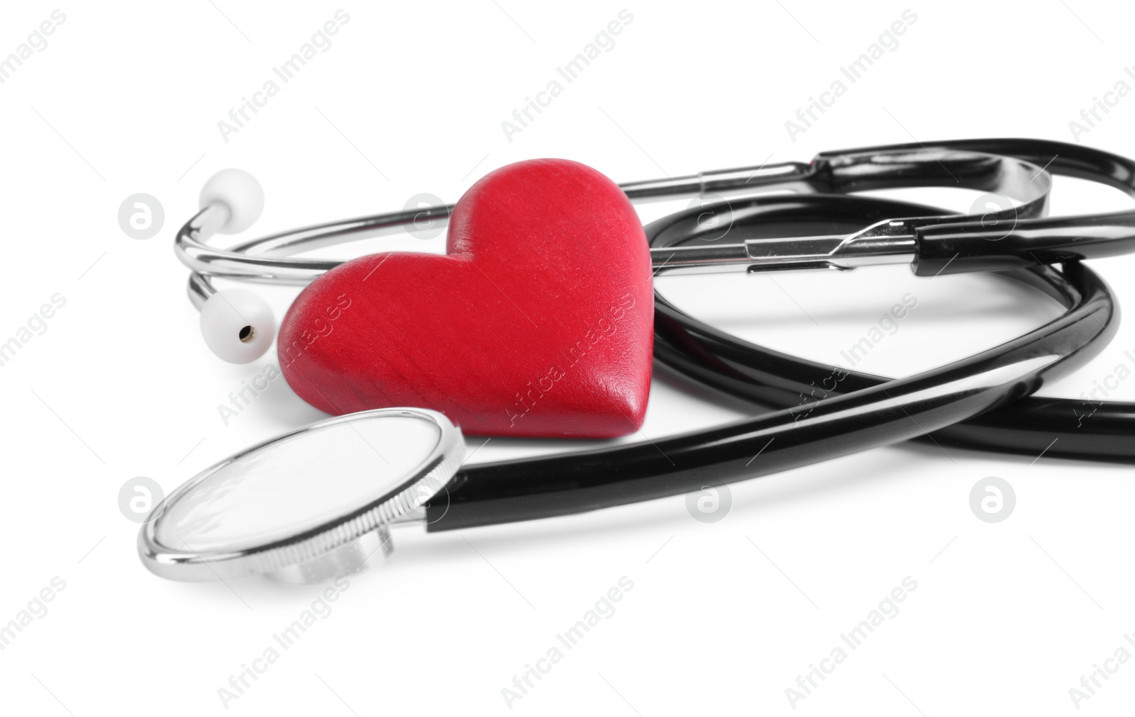 Photo of Stethoscope and red heart isolated on white