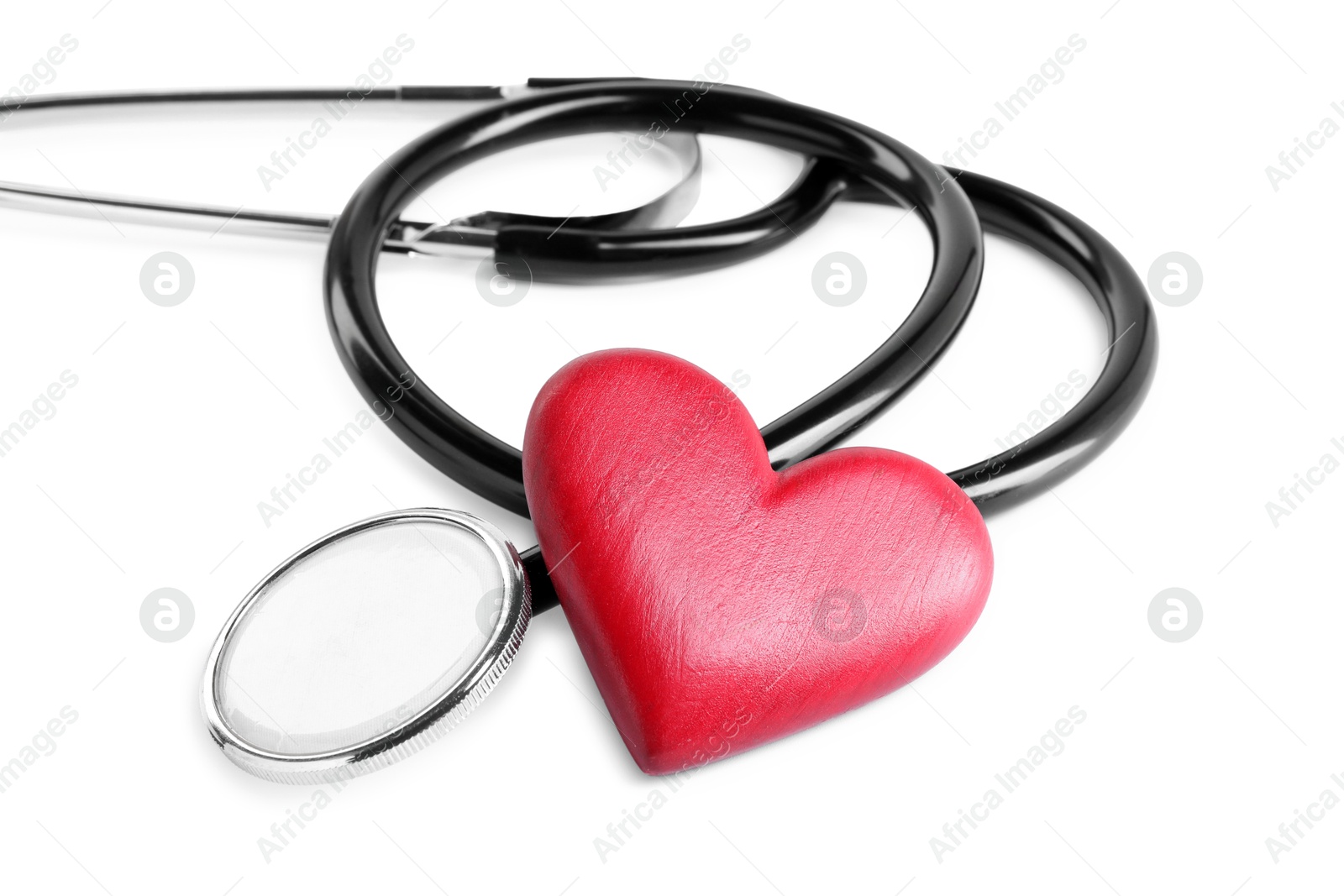 Photo of Stethoscope and red heart isolated on white