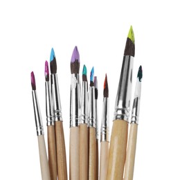 Photo of Wooden brushes with colorful paints isolated on white