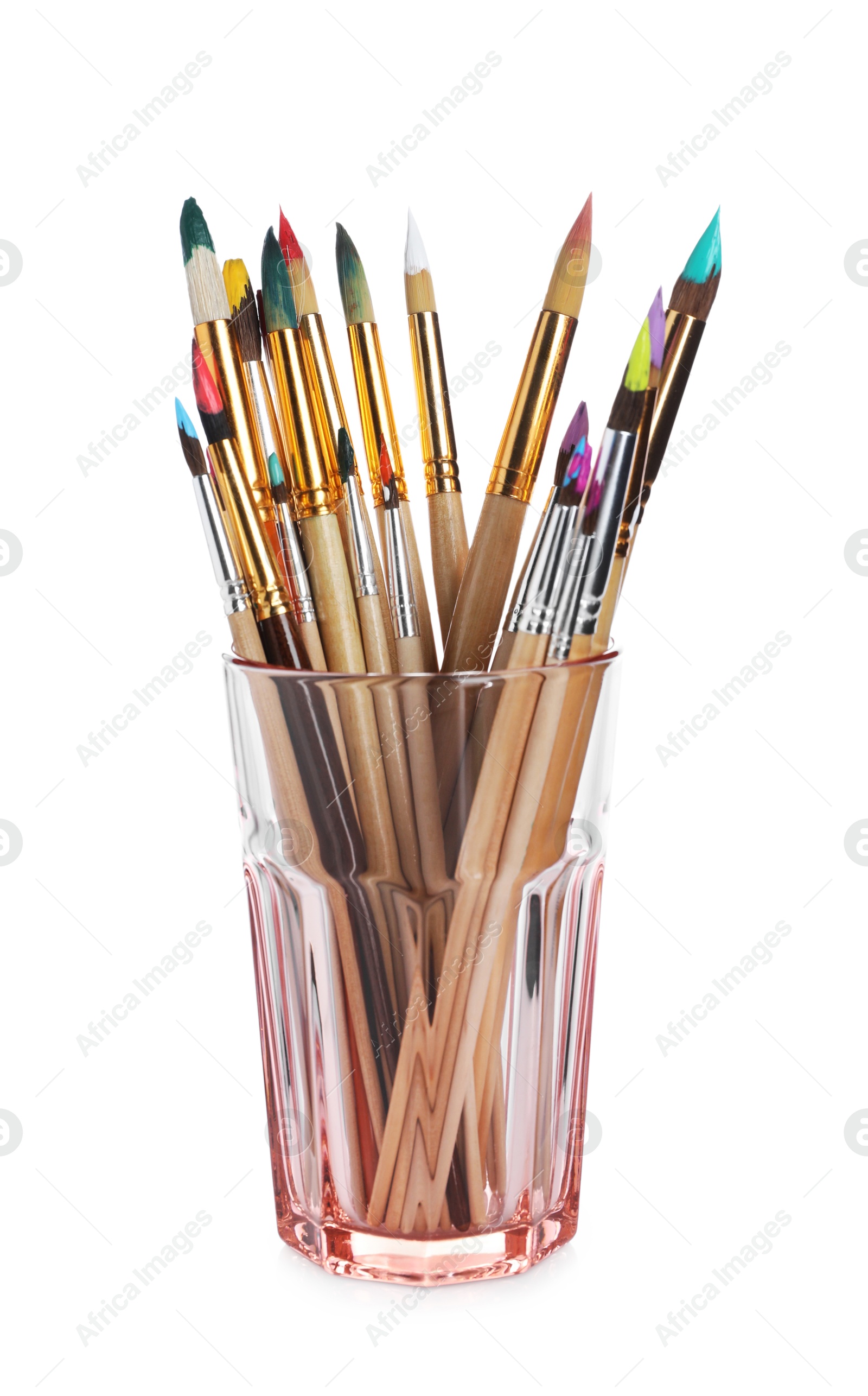 Photo of Wooden brushes with colorful paints in glass isolated on white