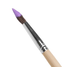 Photo of Wooden brush with purple paint isolated on white