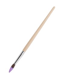 Wooden brush with purple paint isolated on white