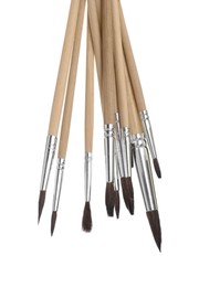 Photo of Many different paint brushes on white background