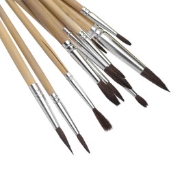 Photo of Many different paint brushes on white background