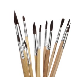 Photo of Many different paint brushes on white background