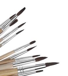 Photo of Many different paint brushes on white background