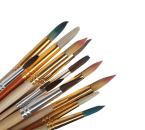 Photo of Many different paint brushes on white background