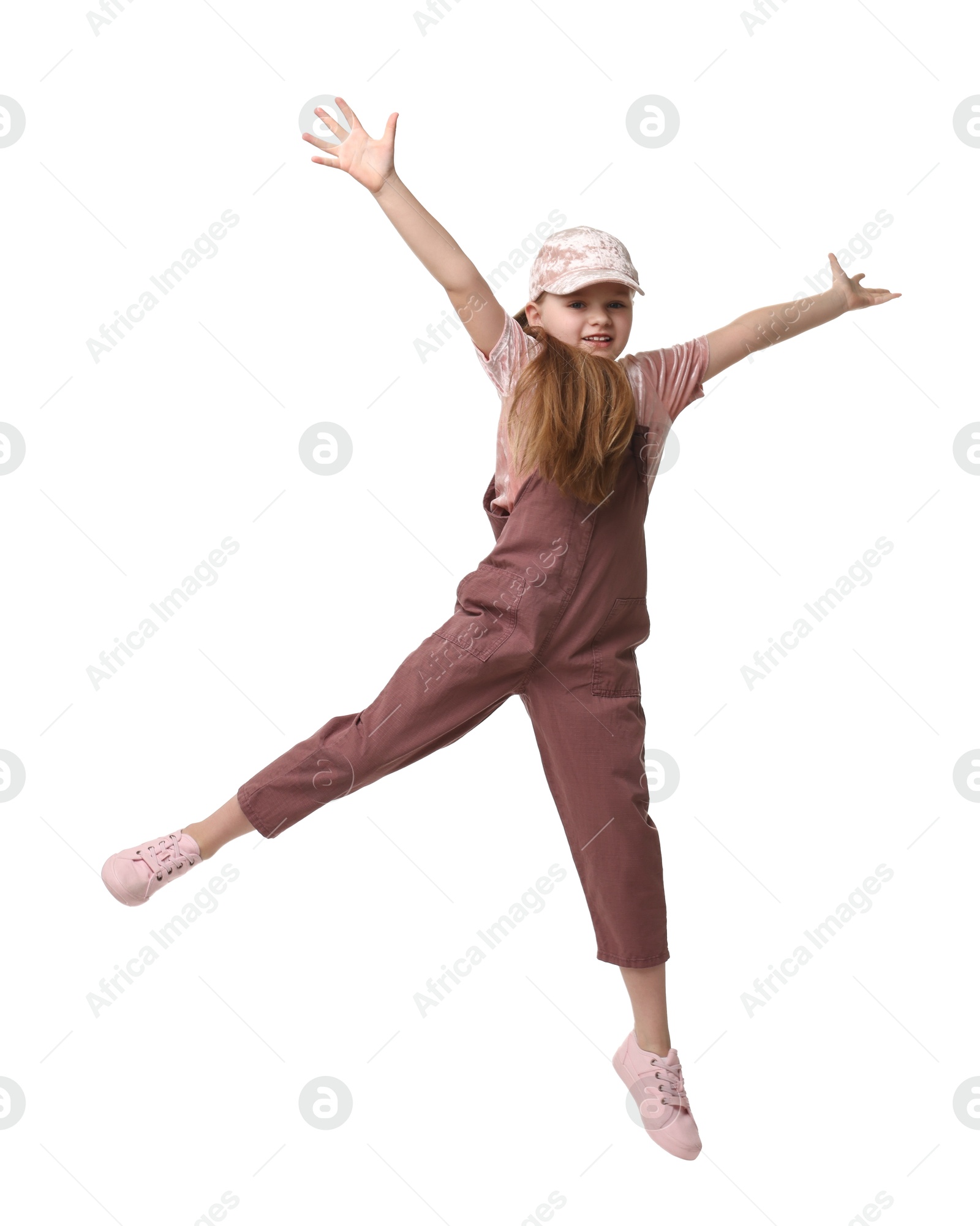 Photo of Cute little girl dancing on white background