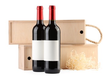 Wooden gift boxes with wine isolated on white