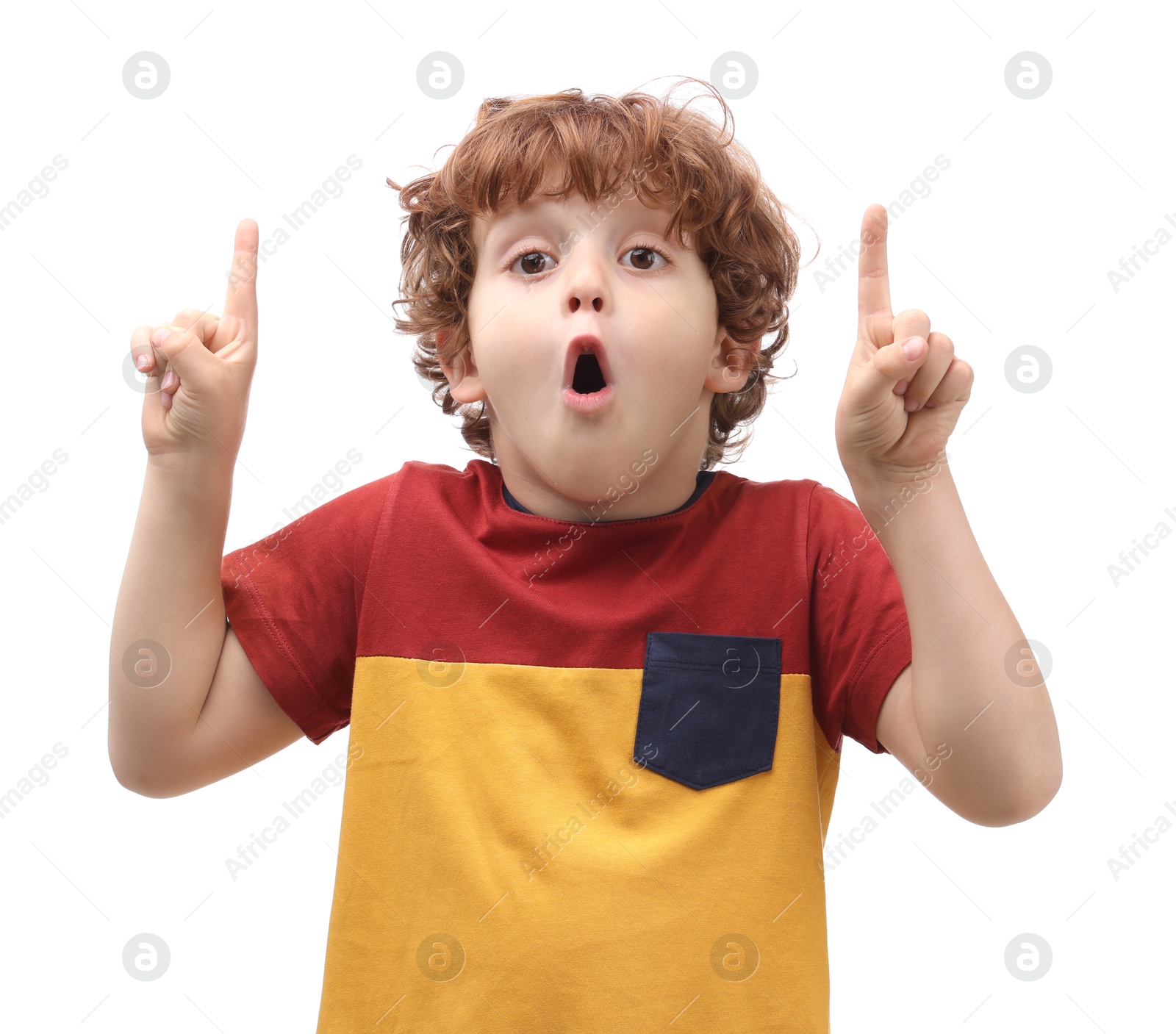 Photo of Portrait of emotional little boy pointing at something on white background