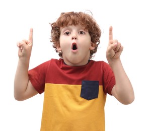Portrait of emotional little boy pointing at something on white background