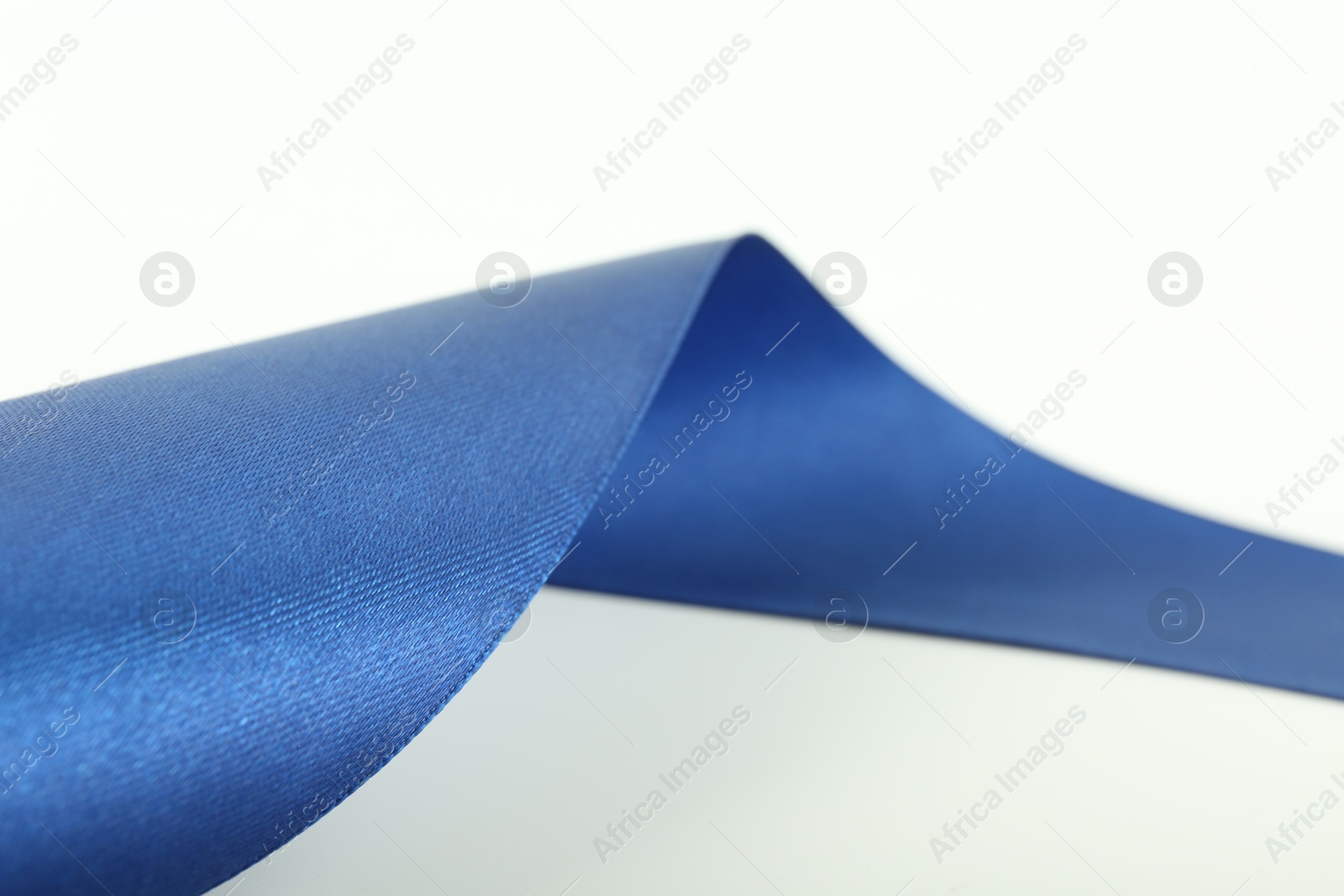 Photo of One beautiful blue ribbon isolated on white