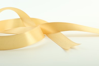 One beautiful light yellow ribbon isolated on white