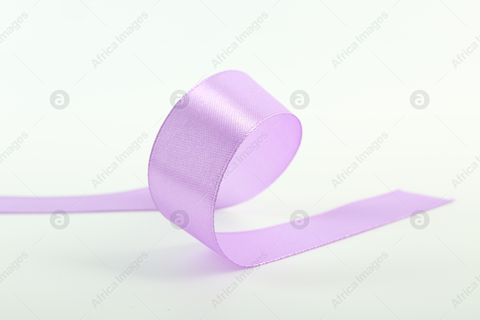 Photo of One beautiful violet ribbon isolated on white