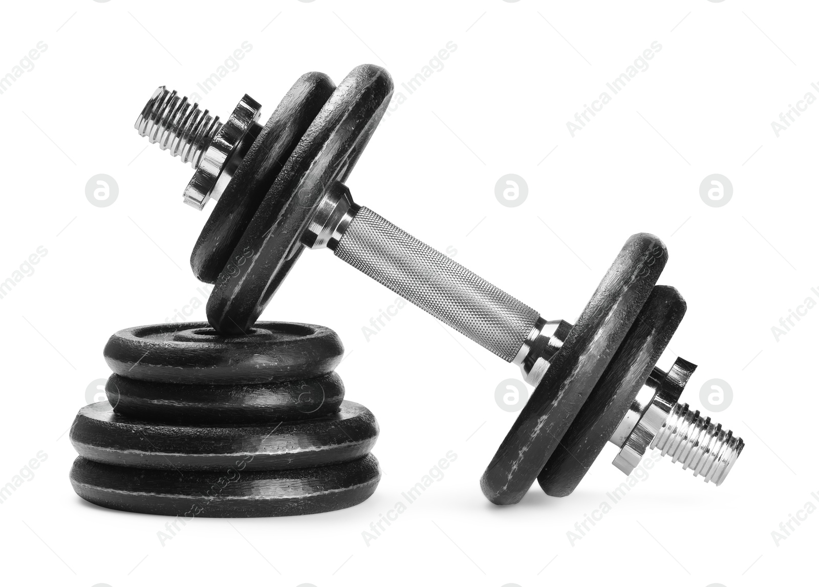 Photo of Barbell and stack of weight plates isolated on white