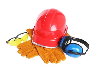 Photo of Hard hat, gloves, earmuffs and protective goggles isolated on white