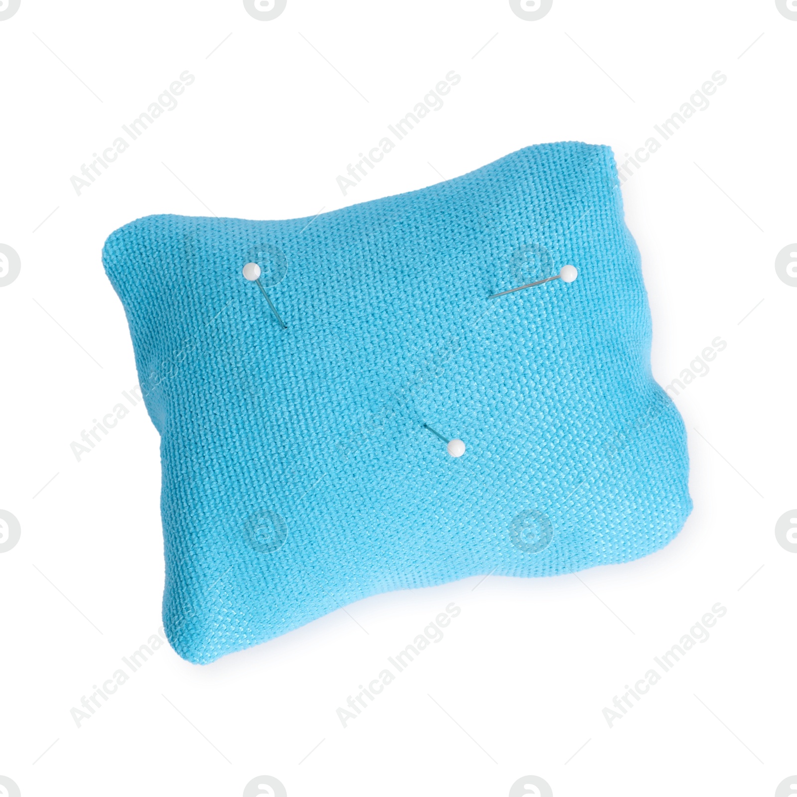 Photo of Light blue pincushion with sewing pins isolated on white, top view