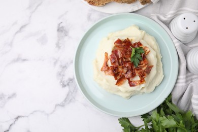 Fried bacon, mashed potato and parsley on white marble table, top view. Space for text