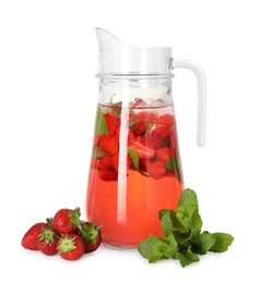 Tasty strawberry lemonade with mint in jug and berries isolated on white