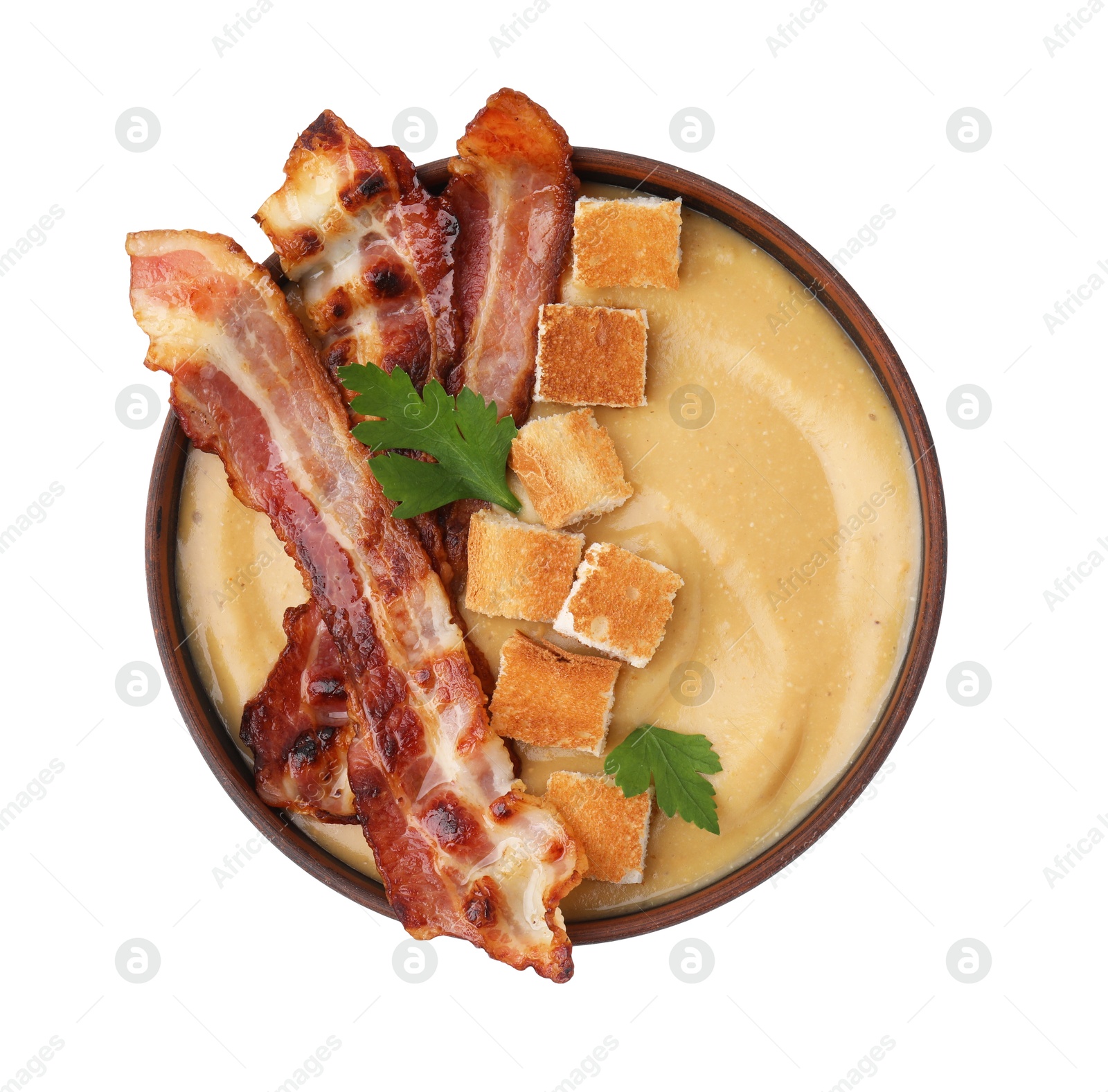 Photo of Delicious lentil soup with bacon and parsley in bowl isolated on white, top view