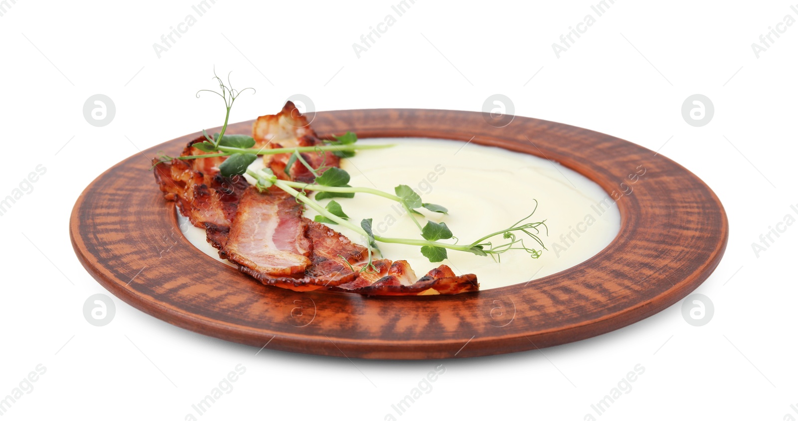 Photo of Delicious potato soup with bacon and microgreens in bowl isolated on white