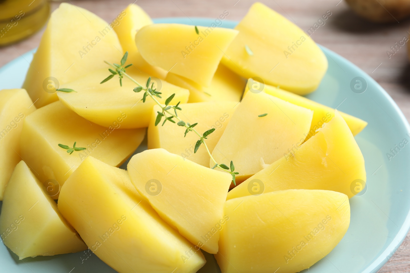 Photo of Boiled potatoes and microgreens on table, closeup