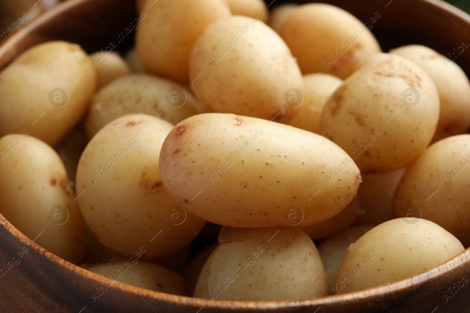 Photo of Tasty boiled potatoes in bowl, closeup view