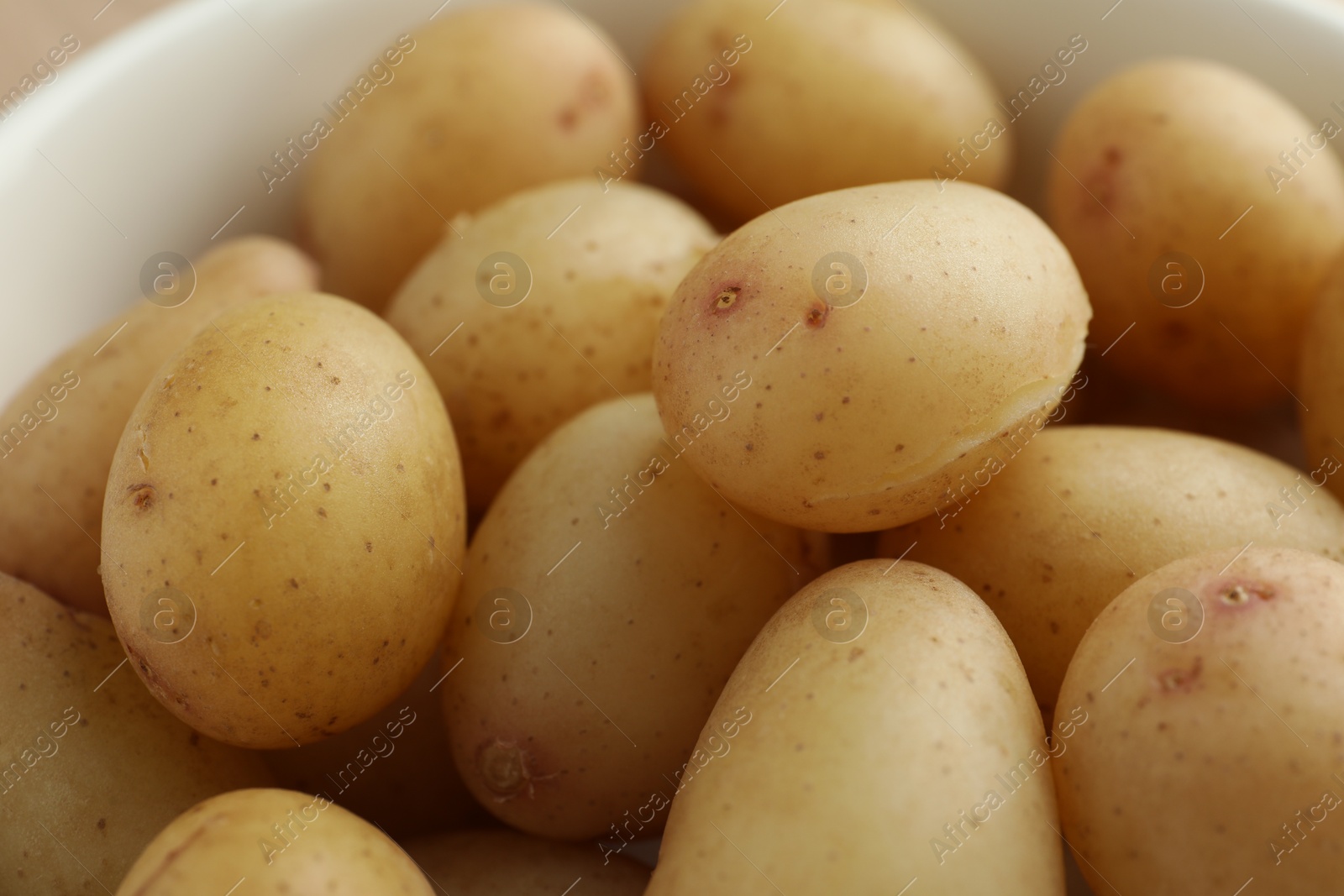 Photo of Tasty boiled potatoes in bowl, closeup view