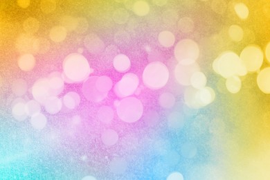 Image of Bright colorful sparkling glitter with bokeh effect, closeup. Background for party invitations or holiday cards