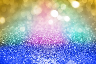 Bright colorful sparkling glitter with bokeh effect, closeup. Background for party invitations or holiday cards
