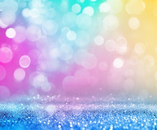 Bright background with sparkling glitter and bokeh effect, closeup. Backdrop for party invitations or holiday cards