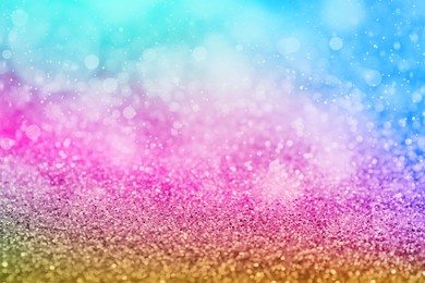 Image of Bright colorful sparkling glitter with bokeh effect, closeup. Background for party invitations or holiday cards