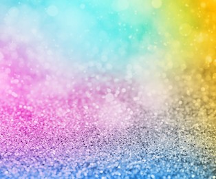 Bright colorful sparkling glitter with bokeh effect, closeup. Background for party invitations or holiday cards