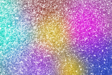 Image of Bright colorful sparkling glitter, closeup. Background for party invitations or holiday cards