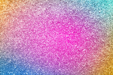 Bright colorful sparkling glitter, closeup. Background for party invitations or holiday cards