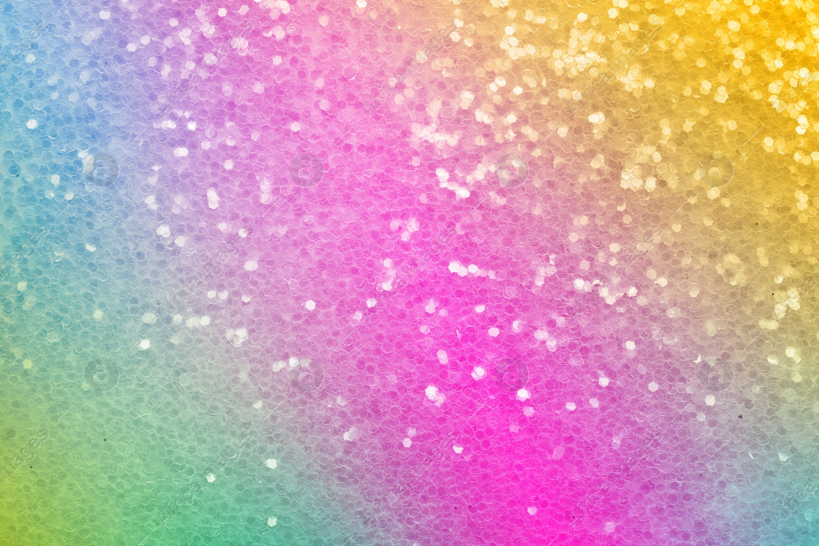 Image of Bright colorful sparkling glitter, closeup. Background for party invitations or holiday cards