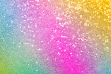 Image of Bright colorful sparkling glitter, closeup. Background for party invitations or holiday cards