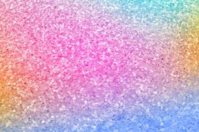 Bright colorful sparkling glitter, closeup. Background for party invitations or holiday cards