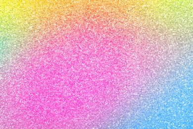 Bright colorful sparkling glitter, closeup. Background for party invitations or holiday cards