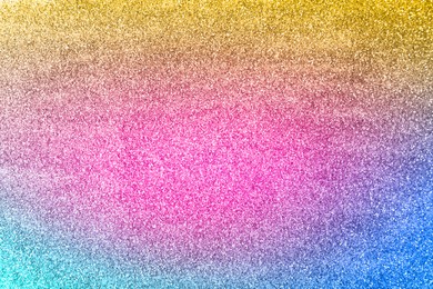 Bright colorful sparkling glitter, closeup. Background for party invitations or holiday cards