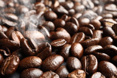 Freshly roasted coffee beans as background, closeup