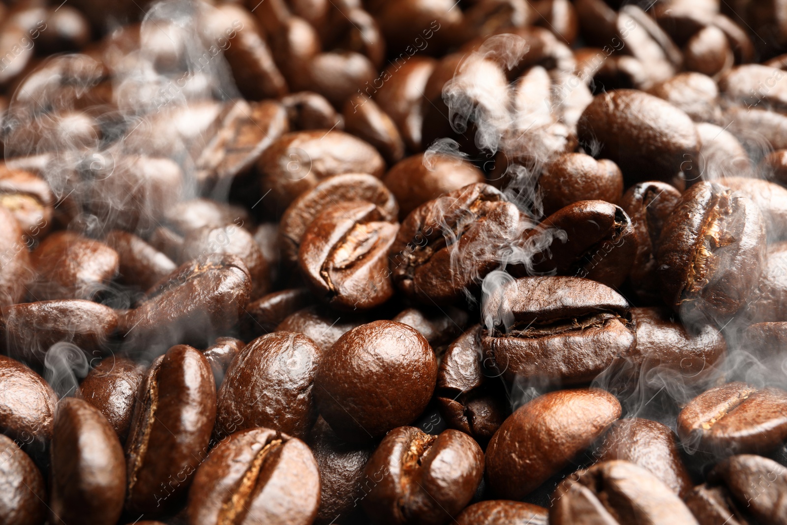 Image of Freshly roasted coffee beans as background, closeup