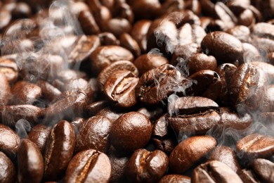 Freshly roasted coffee beans as background, closeup